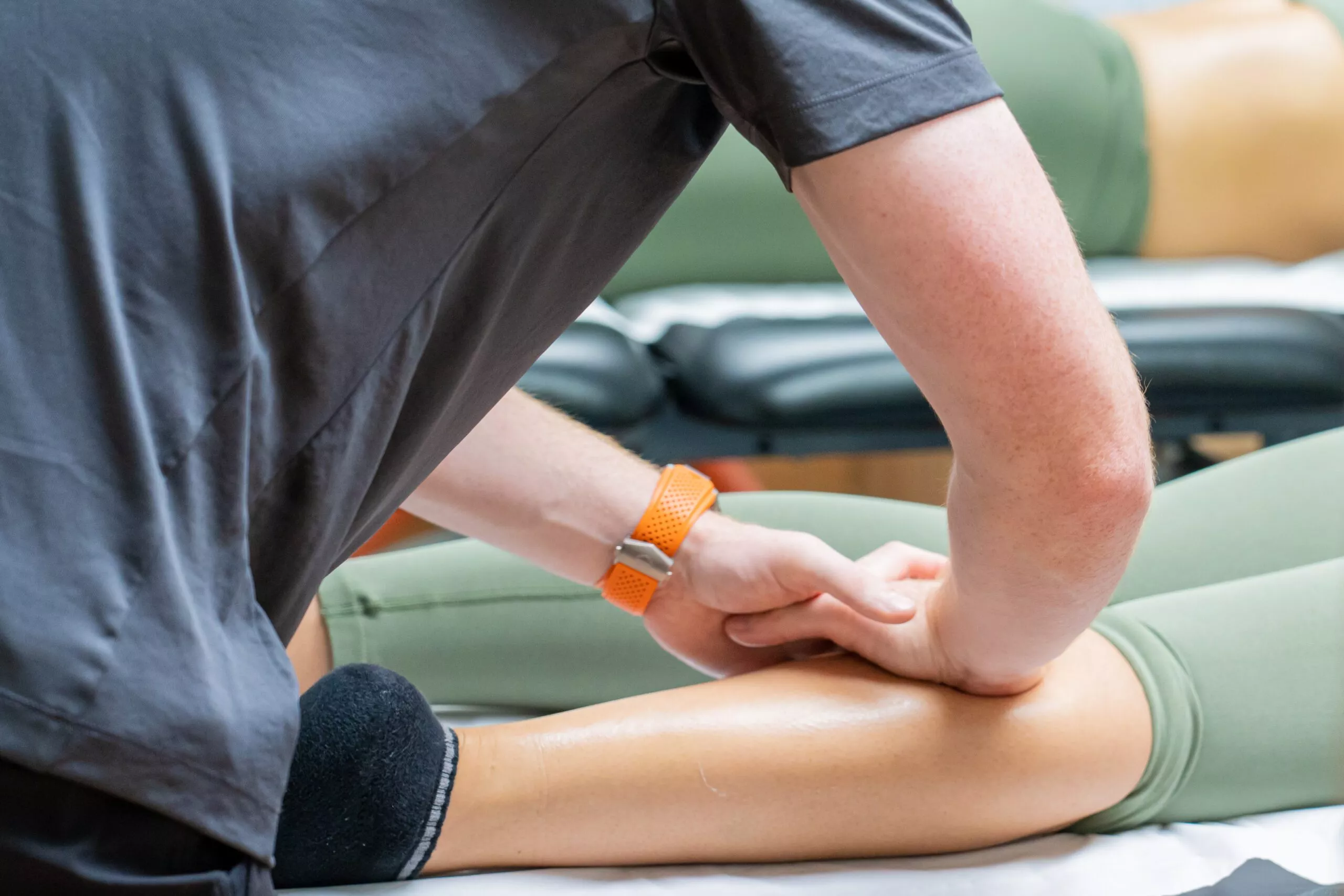 man sitting on the ground with a bandage around his arm